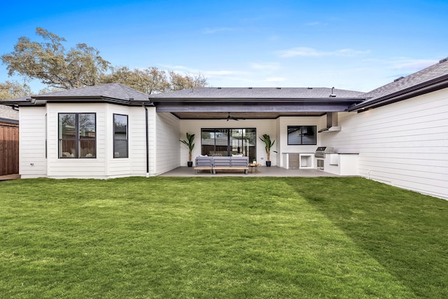 back of house with a lawn, a ceiling fan, a patio, fence, and outdoor lounge area