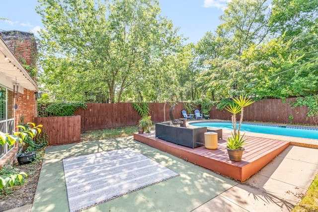 view of patio featuring a fenced in pool and a fenced backyard