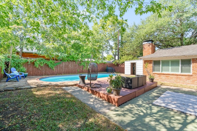 view of swimming pool with a fenced in pool, a patio, and a fenced backyard