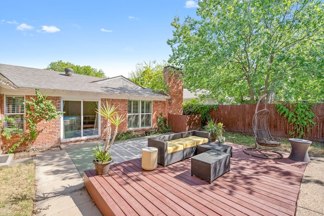 wooden terrace featuring fence and an outdoor hangout area