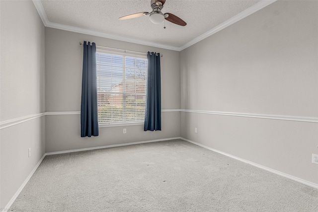 carpeted empty room with ornamental molding, a ceiling fan, baseboards, and a textured ceiling