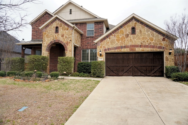 view of front of property featuring brick siding, stone siding, an attached garage, and concrete driveway