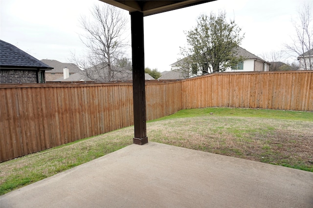 view of yard featuring a patio and a fenced backyard