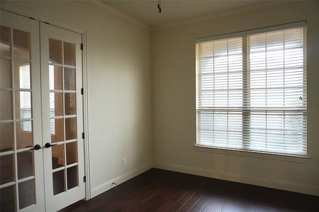 unfurnished room featuring dark wood-style floors, french doors, baseboards, and ornamental molding