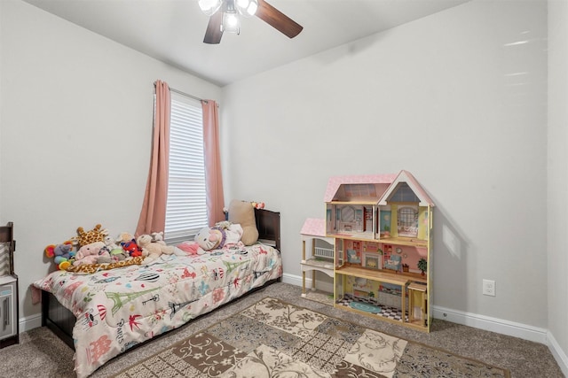 carpeted bedroom with a ceiling fan and baseboards