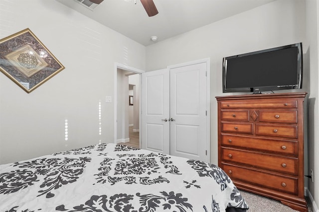 bedroom with visible vents, a closet, and ceiling fan