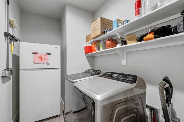 laundry room featuring laundry area and washer and clothes dryer