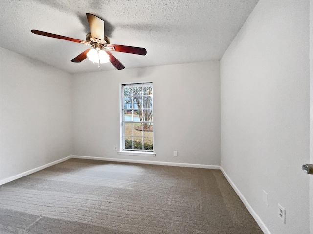 carpeted empty room featuring a textured ceiling, baseboards, and ceiling fan