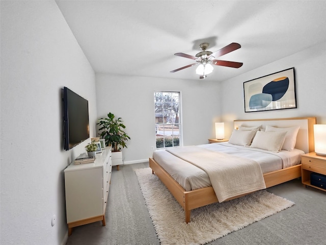 carpeted bedroom with baseboards and ceiling fan