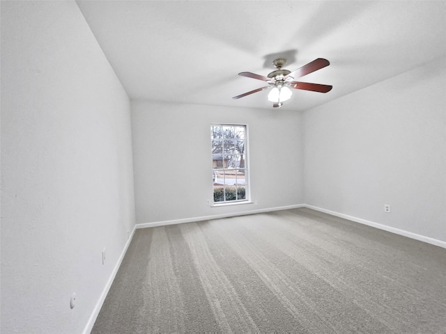 empty room with baseboards, carpet, and ceiling fan