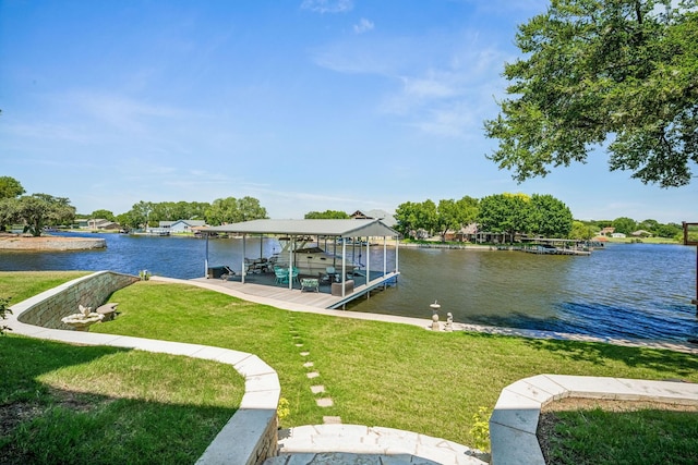 view of dock with a yard, a water view, and boat lift