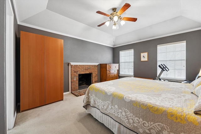 bedroom featuring a tray ceiling, crown molding, light colored carpet, and vaulted ceiling