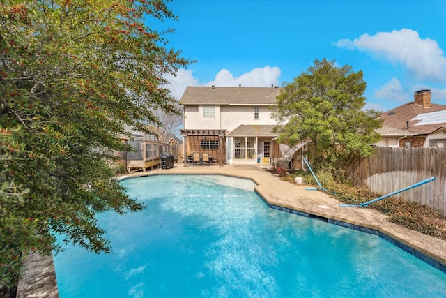 view of swimming pool featuring a fenced in pool, a fenced backyard, and a patio area