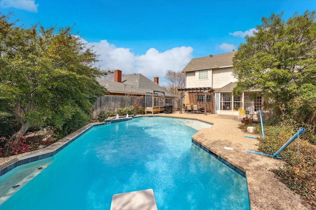 view of swimming pool featuring a fenced in pool, a patio, a pergola, and a fenced backyard