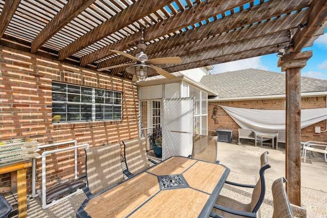 view of patio / terrace with outdoor dining area, a ceiling fan, and a pergola