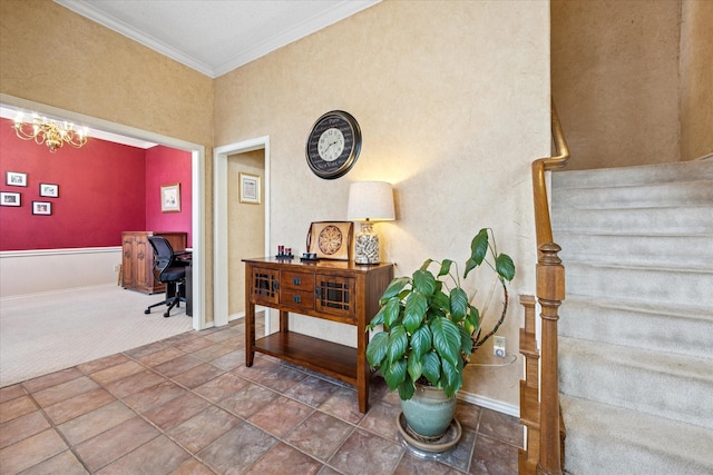 stairway featuring an inviting chandelier, baseboards, carpet floors, and ornamental molding