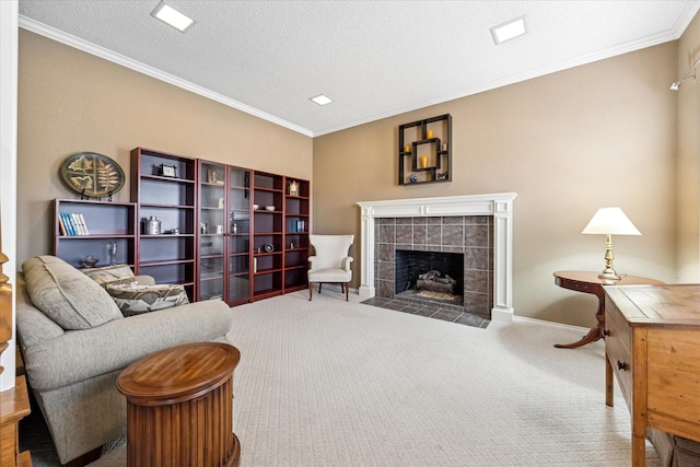 living room with carpet flooring, a fireplace, a textured ceiling, and crown molding