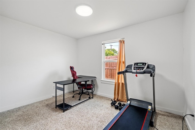 workout area with carpet and baseboards