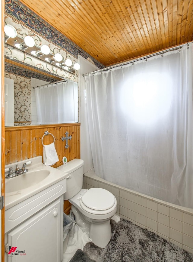 bathroom with vanity, wooden ceiling, toilet, and shower / bath combo with shower curtain