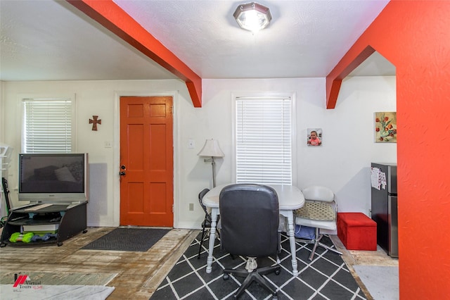 office area with a textured ceiling