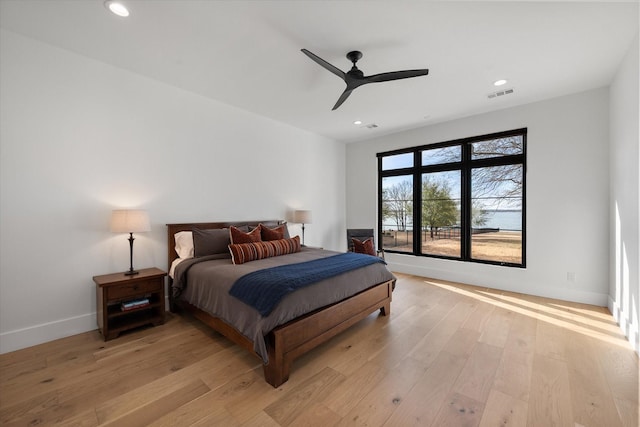 bedroom with recessed lighting, light wood-style floors, visible vents, and baseboards