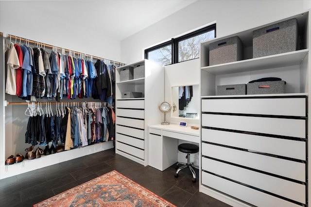 walk in closet featuring dark wood-style flooring