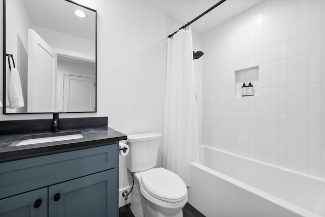 bathroom featuring toilet, vanity, and shower / bath combo