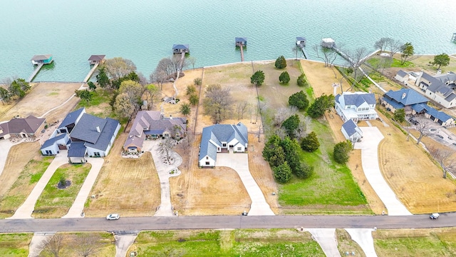 bird's eye view with a residential view and a water view