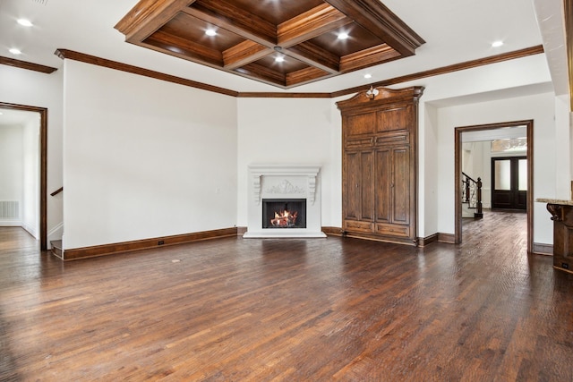 unfurnished living room with crown molding, dark wood-style floors, coffered ceiling, baseboards, and beam ceiling