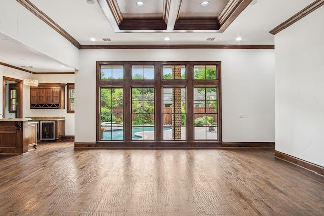 entryway featuring wood finished floors, recessed lighting, baseboards, crown molding, and wine cooler