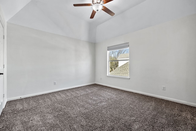 unfurnished room with dark carpet, baseboards, lofted ceiling, and ceiling fan