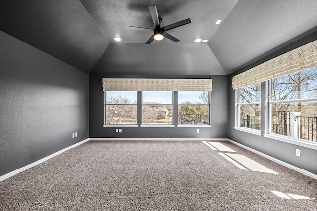 empty room with carpet flooring, baseboards, and ceiling fan