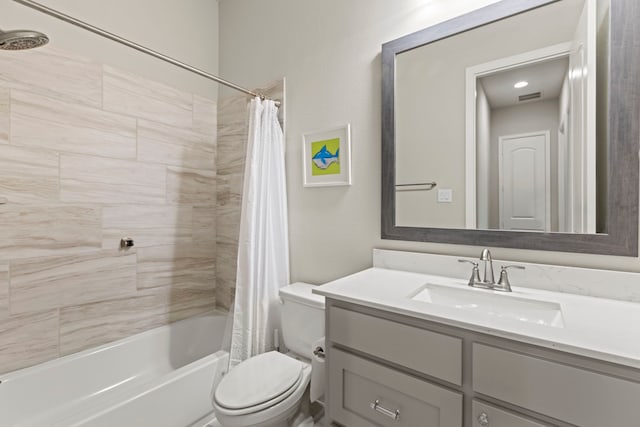 full bath with visible vents, toilet, vanity, and shower / tub combo with curtain