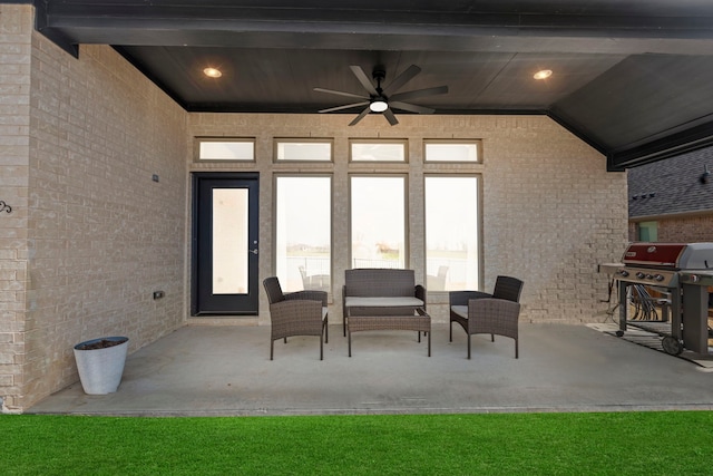 view of patio with area for grilling, a ceiling fan, and an outdoor hangout area