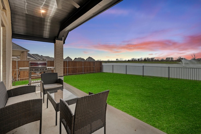 view of yard featuring outdoor lounge area, a patio area, and a fenced backyard