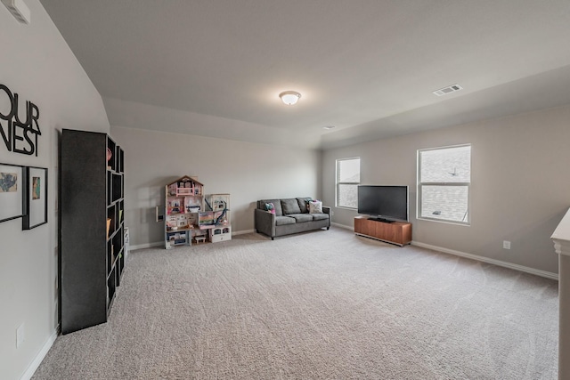 carpeted living room featuring visible vents and baseboards