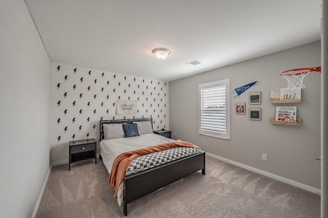 bedroom with visible vents, baseboards, and carpet