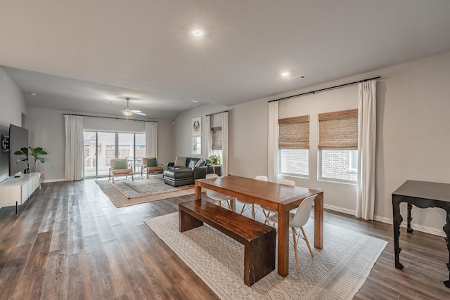 dining space with recessed lighting, baseboards, and dark wood-style flooring