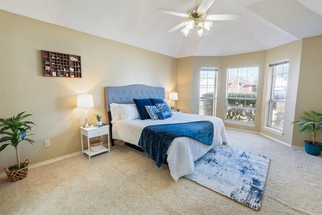 carpeted bedroom with baseboards and ceiling fan