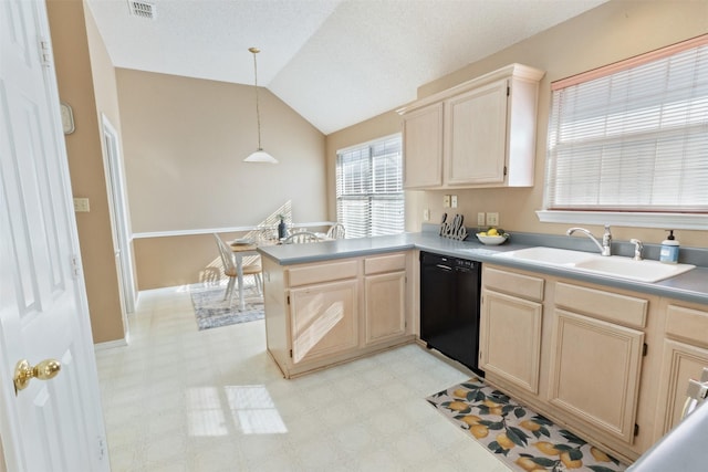 kitchen with light brown cabinetry, a sink, black dishwasher, a peninsula, and light floors