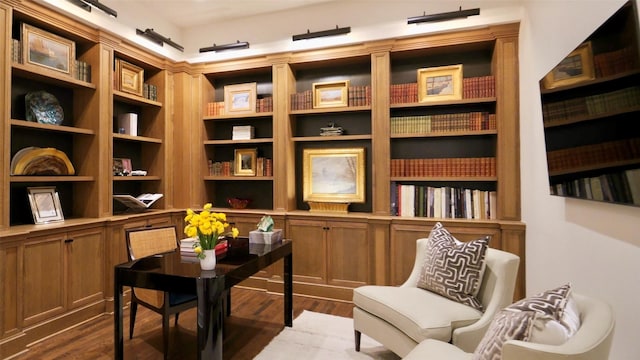 sitting room with dark wood-style flooring