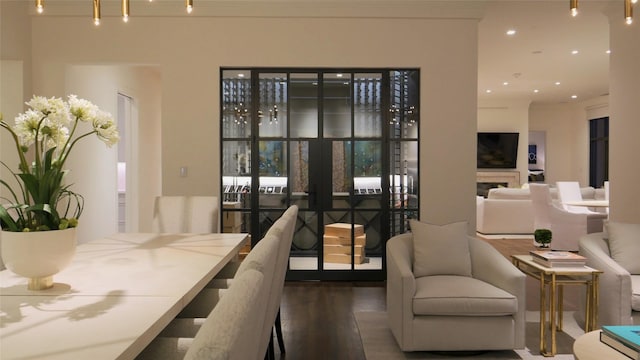 dining space with recessed lighting, french doors, and wood finished floors