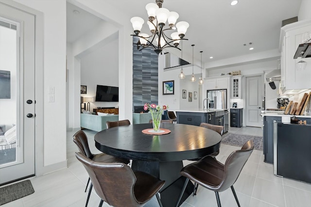 dining room with a notable chandelier, recessed lighting, and light tile patterned floors