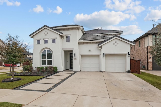 view of front of home featuring a front yard, driveway, stucco siding, a garage, and a tiled roof