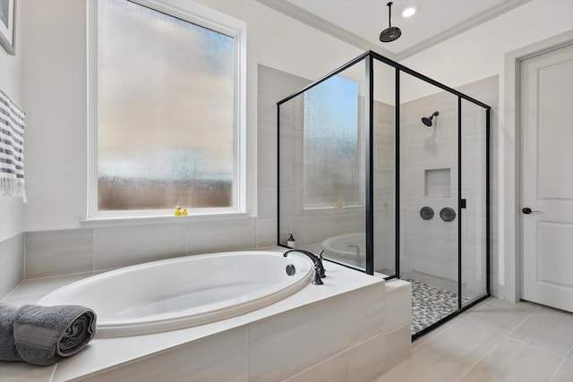 full bath featuring tile patterned flooring, a bath, and a stall shower