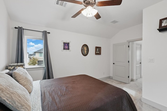 bedroom featuring visible vents, light colored carpet, baseboards, and lofted ceiling