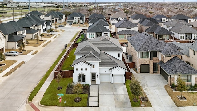 birds eye view of property with a residential view