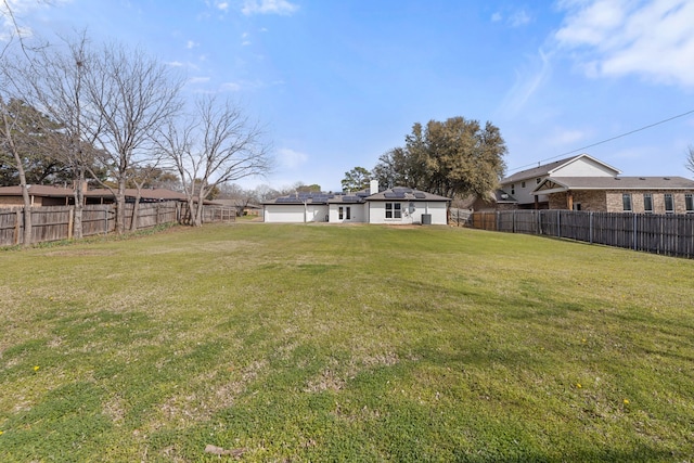 view of yard featuring a fenced backyard