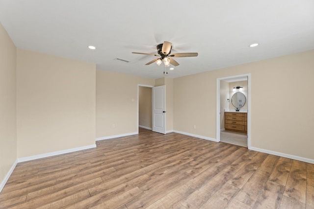 unfurnished room with visible vents, wood finished floors, recessed lighting, baseboards, and ceiling fan