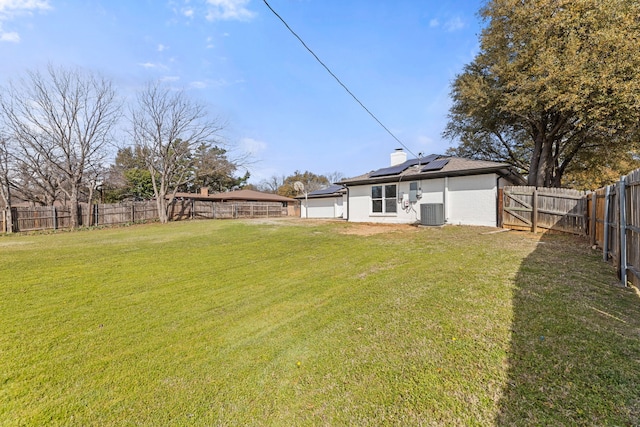 view of yard featuring central air condition unit and a fenced backyard